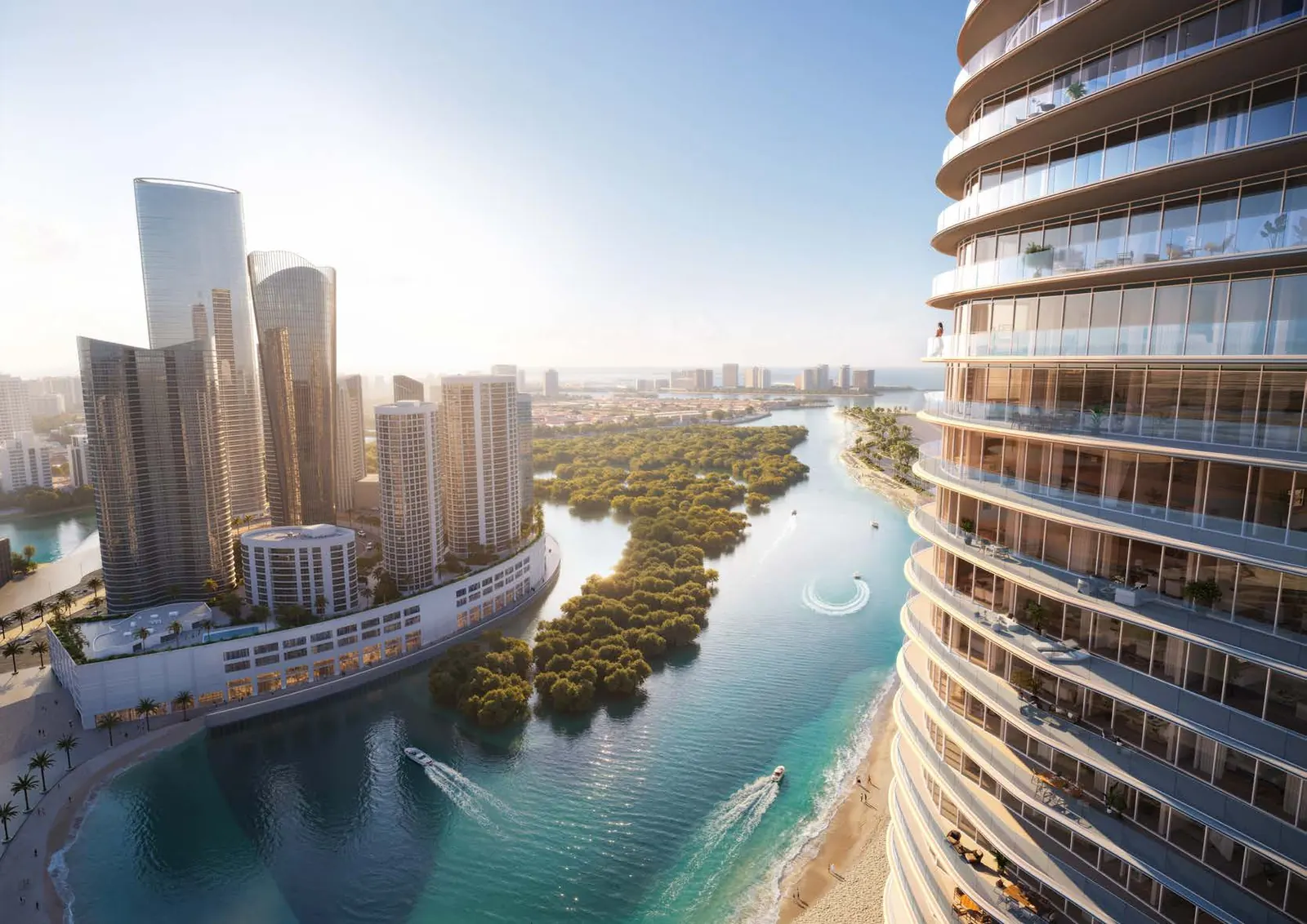 Aerial view of the tower's curved balconies above the canal and mangroves